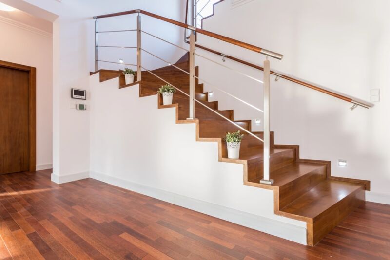 Dark wood stairs with metal railings, inspiration for how to paint wood stairs 