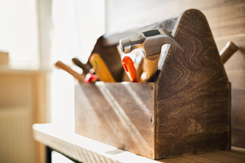 diy wooden toolbox with hammer and different tools inside